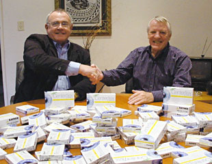 John Muller (left) of SOS delivers the lenses to Herman Kluever